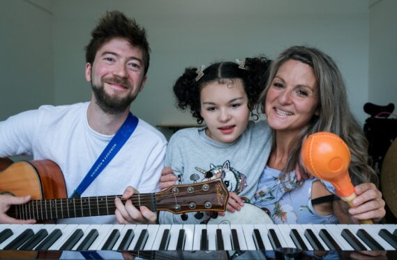 Kia has found a way to express herself through music therapy, much to the delight of mum Steph Sanchez and therapist Reuben Quinn.