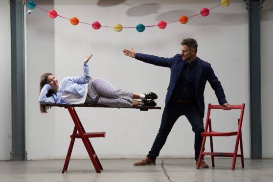 Magician Kevin Quantum makes Sunday Post reporter Lauren levitate.