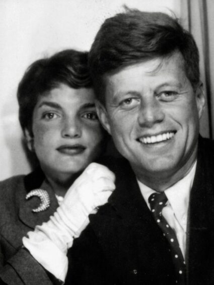 Future US President John F Kennedy takes a selfie with his wife, Jacqueline, in a photo booth, circa 1953.