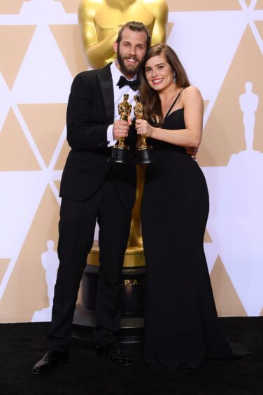 Rachel with husband Chris Overton at the Oscars.