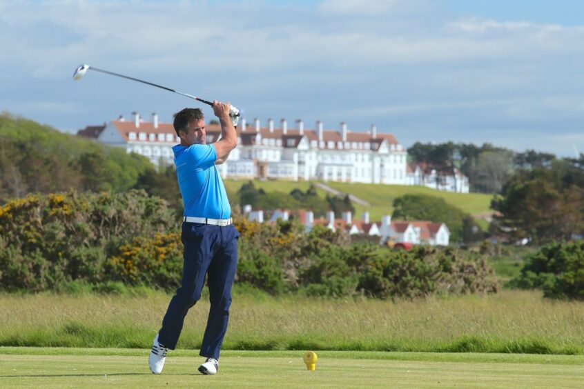 Golfer just taken a shot on the golf course at Turnberry