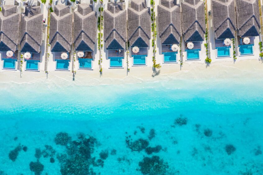 Villas on the white-sand beach.