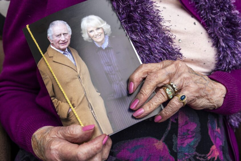 Nancy holding her card. Her ring was bought when Roselea was a jeweller’s.