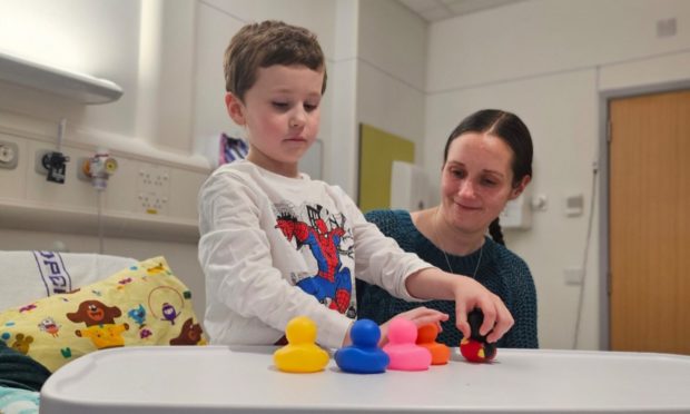 Isaac Tocher, 7 and mother Vicky. Disabled children are more likely to be subject to restraint and seclusion from classrooms, data shows.