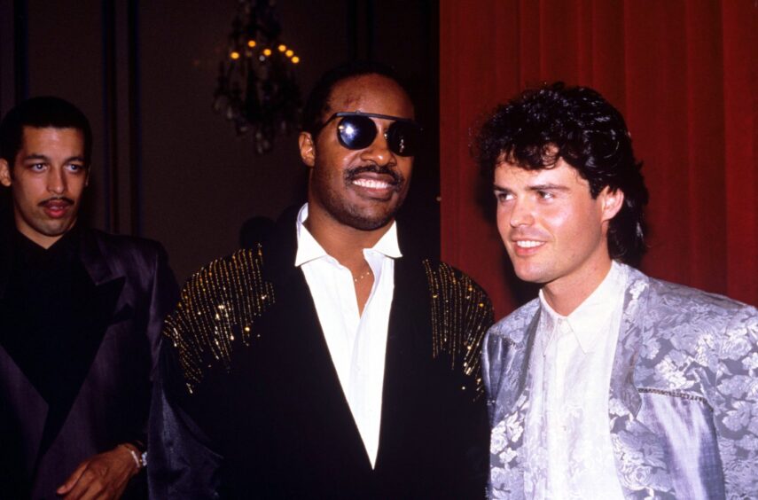 Donny with Stevie Wonder in 1986.