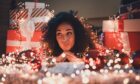 woman poses amid Christmas home décor ideas