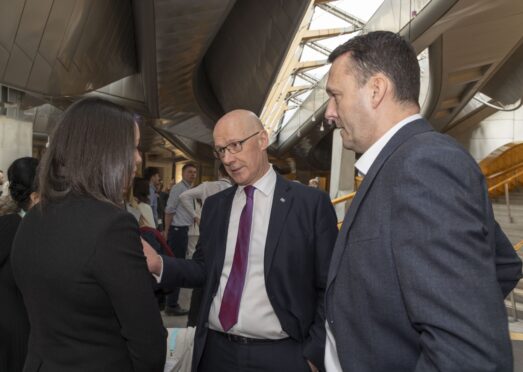 First Minister John Swinney apologises to Denise Clair in Holyrood.