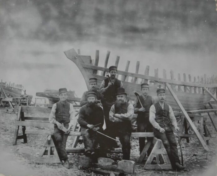 The boat building team at Fyfe's on the Isle of Bute, circa 1920s.