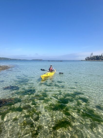 Kayaking in the beautifully pristine waters of Nova Scotia.