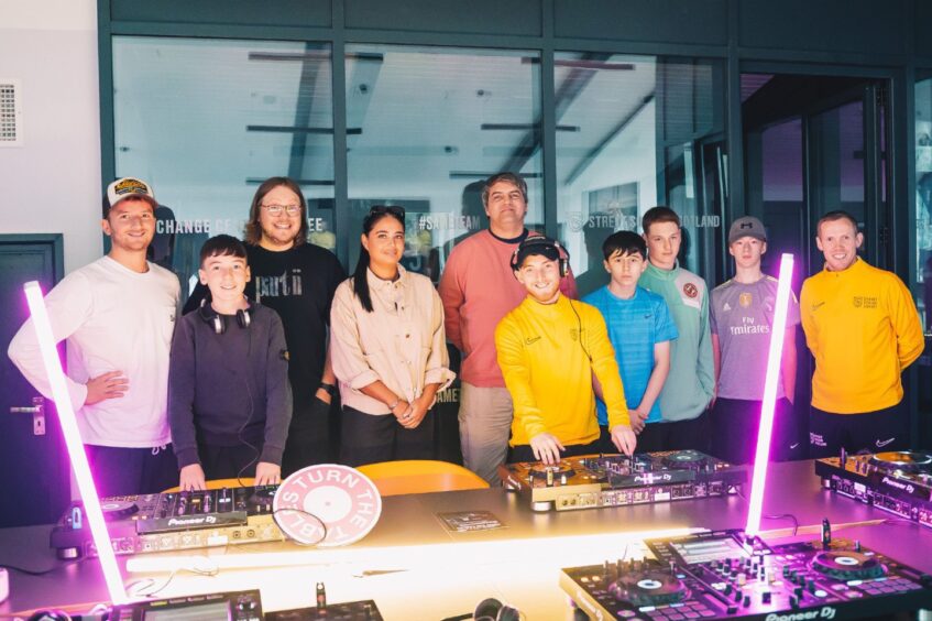 Turn The Tables’ Robbie Tolson, Arbroath DJ Van Damn, Hannah Laing and players from Street Soccer Scotland at a workshop run by doof Studios.