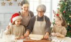 generations of women in a family baking for christmas