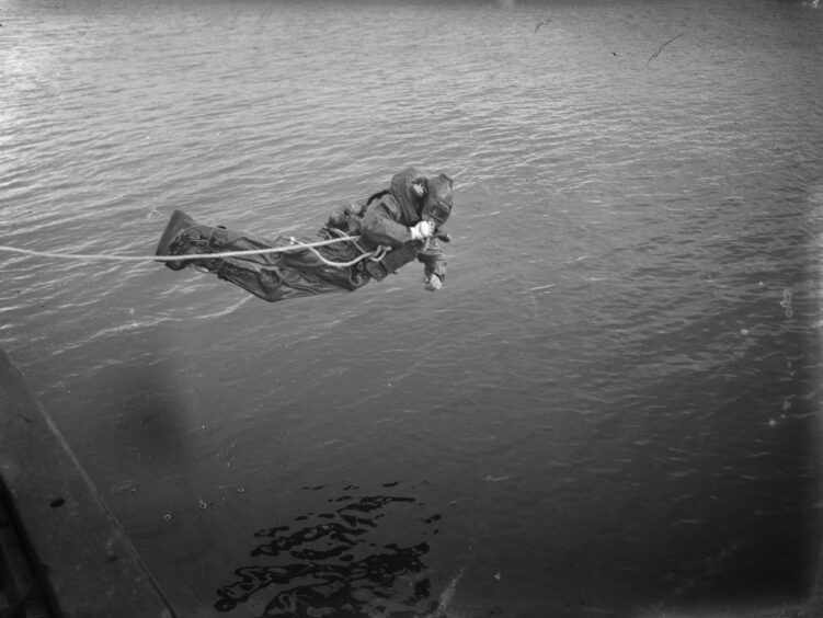 Diver takes off from the ship.