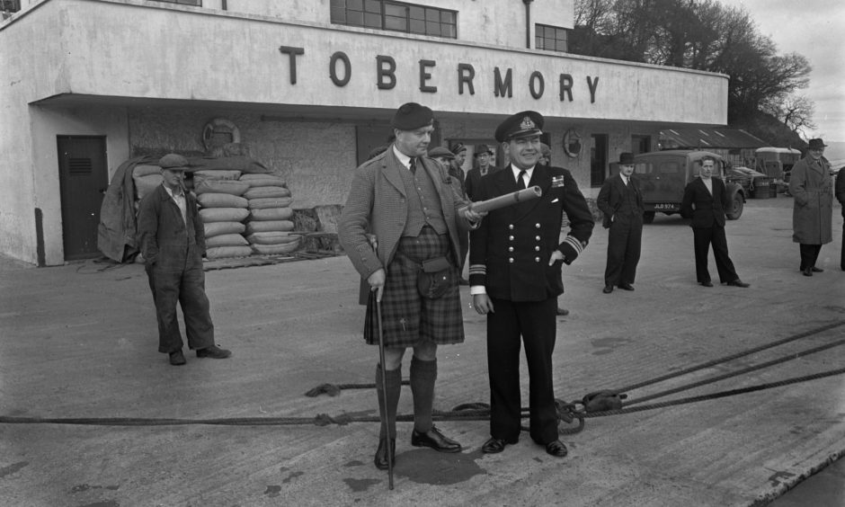 The Duke of Argyll with his treasure map, left, at Tobermory in 1958.