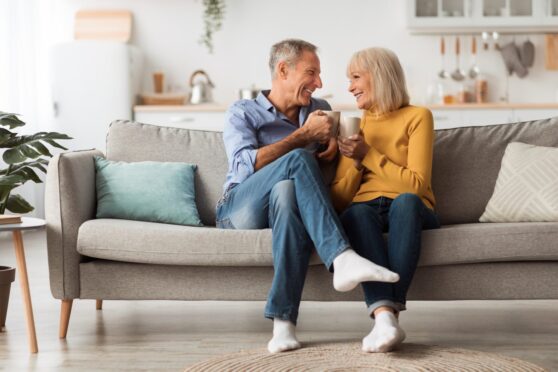 older couple smiling on sofa