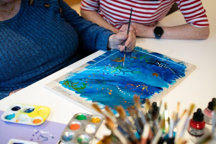 Alison painting.