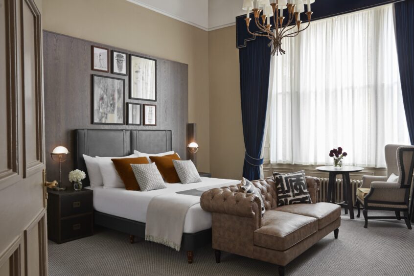 A luxurious bedroom suite at Kimpton Charlotte Square.
