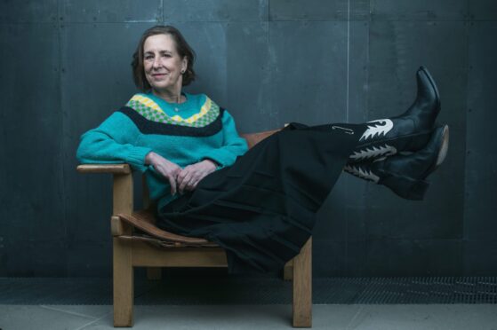 Kirsty Wark in Spanish cowboy boots, La Fetiche sweater and kilt by Samantha McCoach.