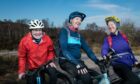 Tim Tindle, centre, wife Penny, right, and John Walker will ascend 28,000 feet during the trip.