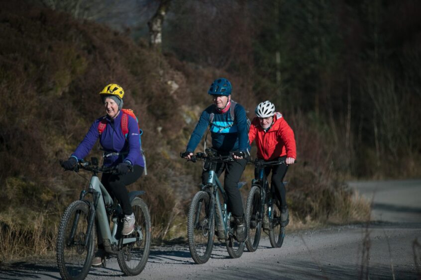 The trio are helping a charity that donates bikes to children with cancer.