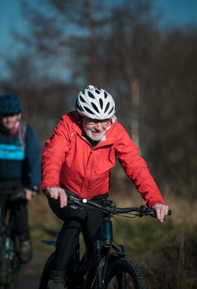 John Walker on his bike in the Trossachs.