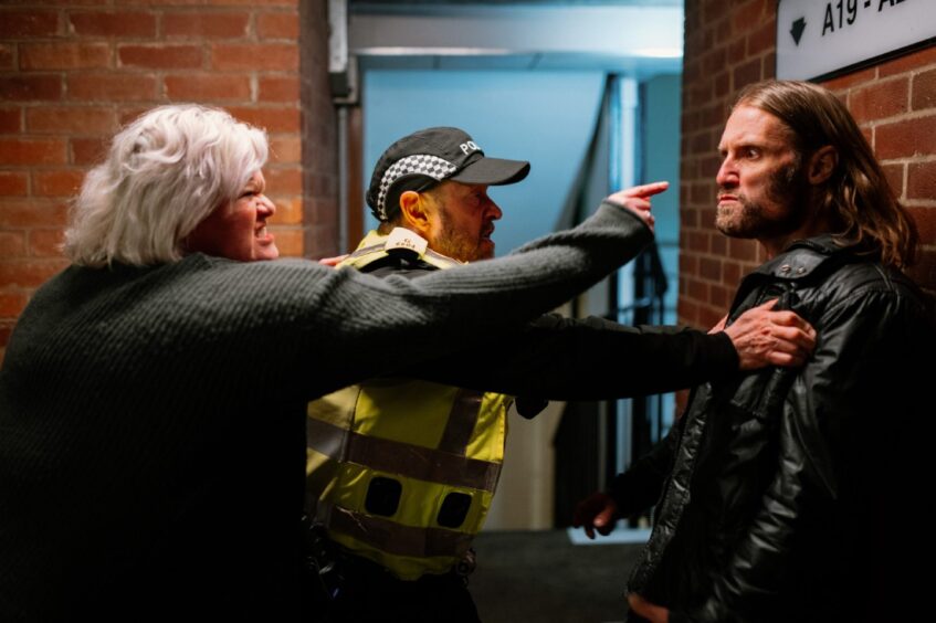 Officers attend a domestic dispute in the film.