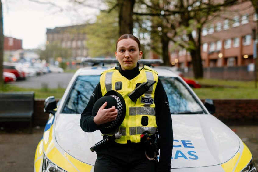 An actor plays an officer who has just talked down a teenager from the roof of the building.