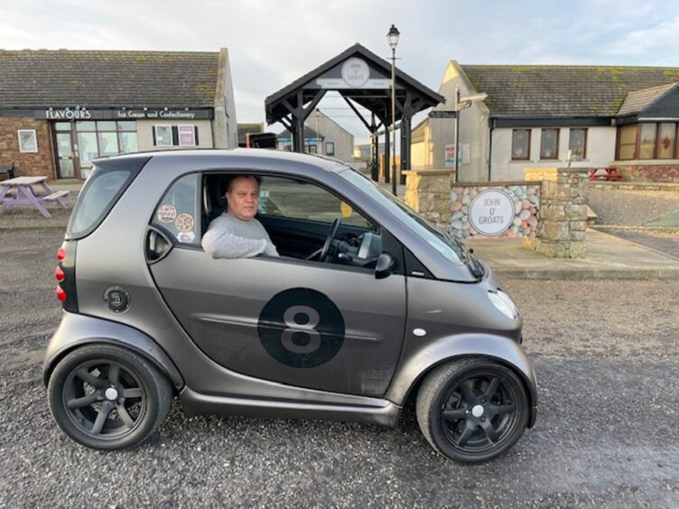 David Ward in his Smart car.
