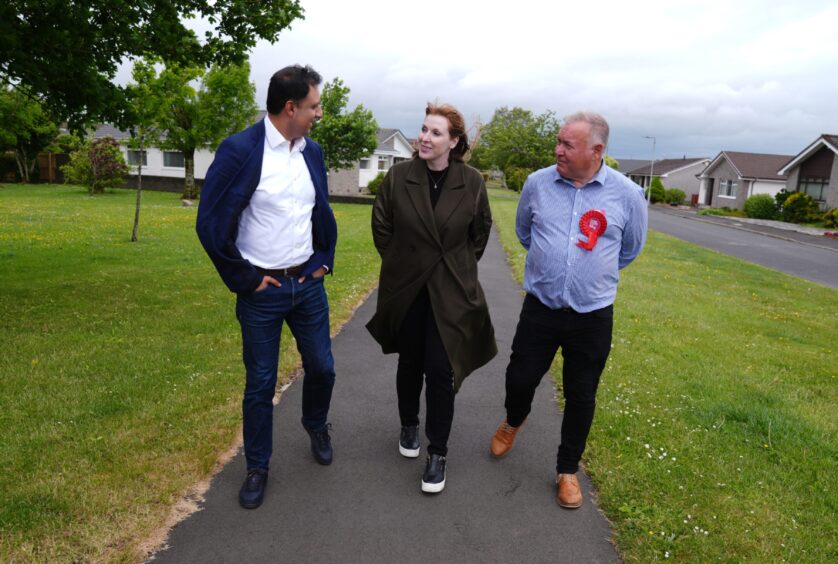 Deputy Prime Minister Angela Rayner with Scottish Labour leader Anas Sarwar and Labour party candidate Davy Russell during a walk about in Quarter.