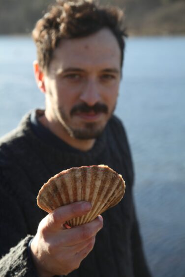 Andrea Ladas with a hand-dived scallop