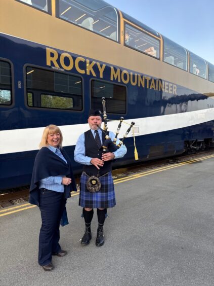 Piper Mike Chisholm, a fourth-generation Nova Scotian, with Sally.