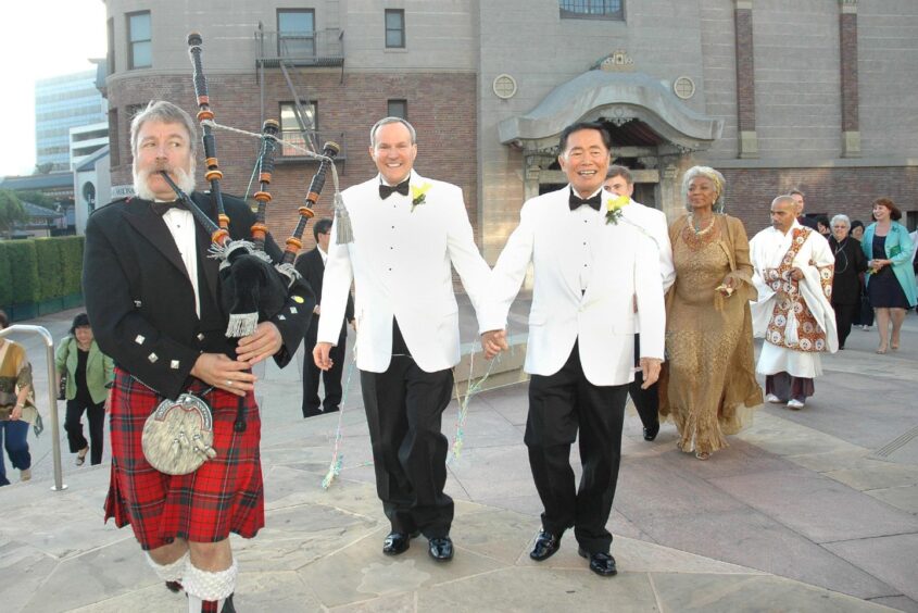 A piper played as George wed long-term partner Brad in 2008.