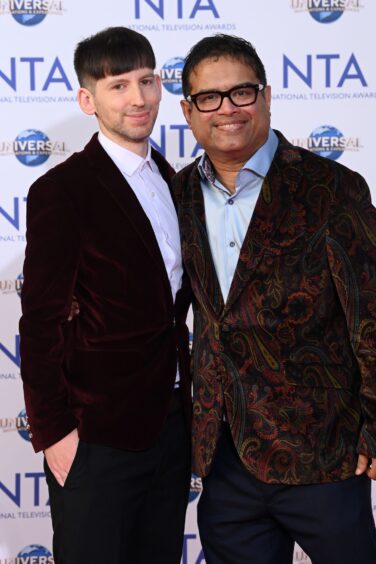 Paul and husband Oliver Levy.