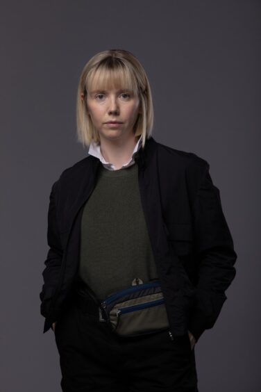 Lauren as Karen, with the all-important bum-bag.