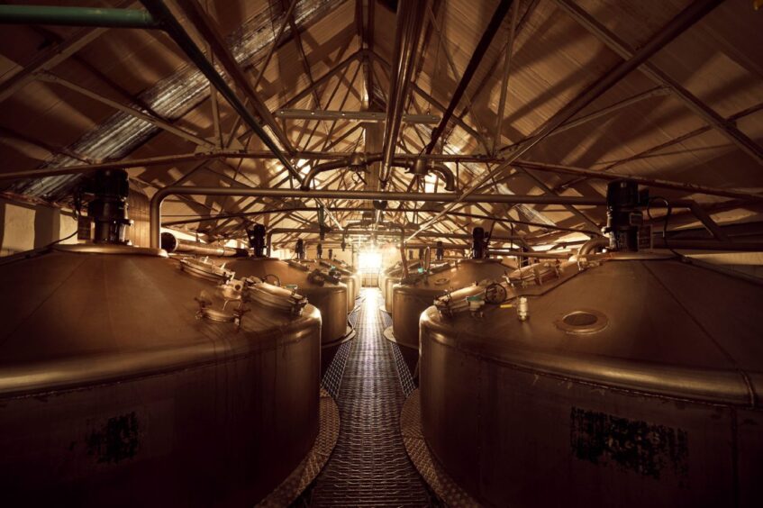 The shiny copper stills at Tomatin’s well -regarded whisky distillery.