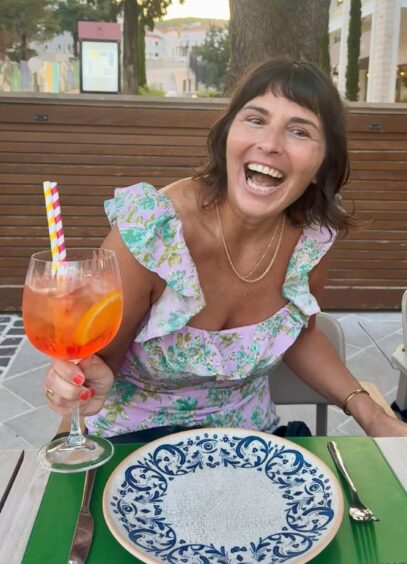 Sara enjoying a delicious lemongrass spritz.
