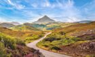 a-road-winds-through-the-highland-landscape