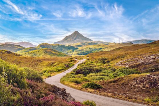 a-road-winds-through-the-highland-landscape