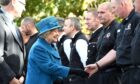 The Queen meeting members of the Ballater community who were affected by flooding during Storm Frank in 2016.