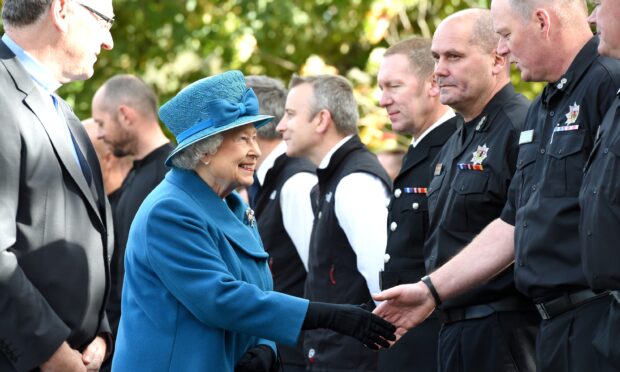 The Queen meeting members of the Ballater community who were affected by flooding during Storm Frank in 2016.