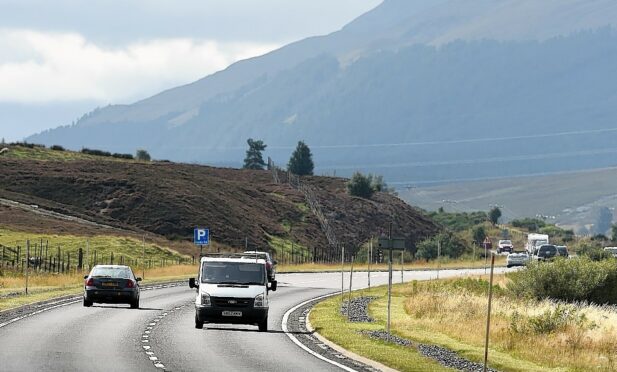The A9 over Drumochter Pass close to Dalwhinnie busy with traffic.