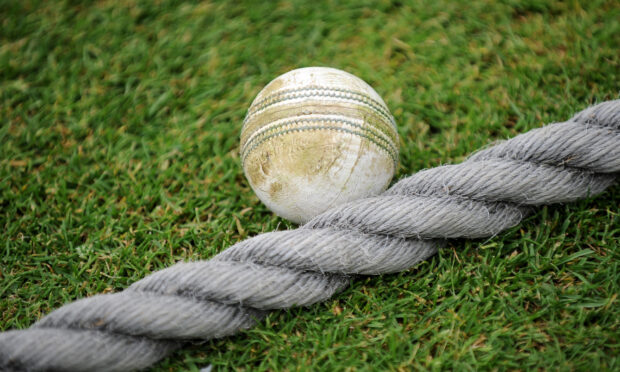 A cricket ball on the boundary .