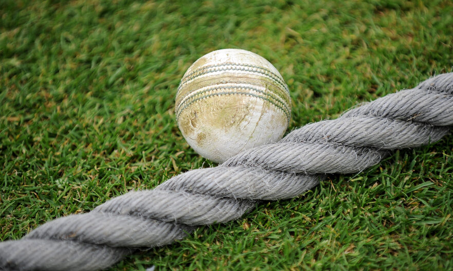 A cricket ball on the boundary .