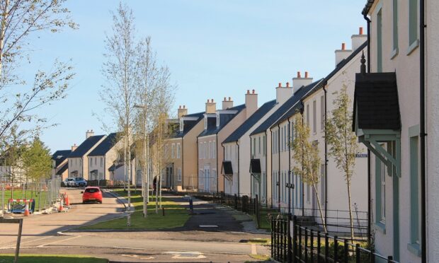 Chapelton of Elsick street with trees and houses.