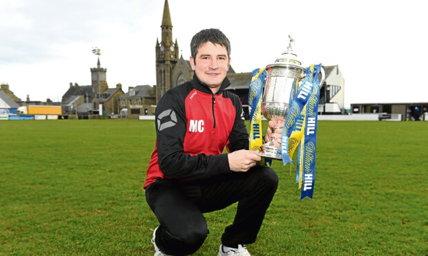 Fraserburgh manager Mark Cowie, pictured, with the Scottish Cup is looking forward to facing Arbroath in round three