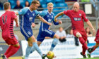 Rory McAllister fires a shot at goal while playing for Peterhead against Queen's Park in 2018.