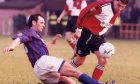 Alan Hercher in action for Caley Thistle against Rangers in 1996.