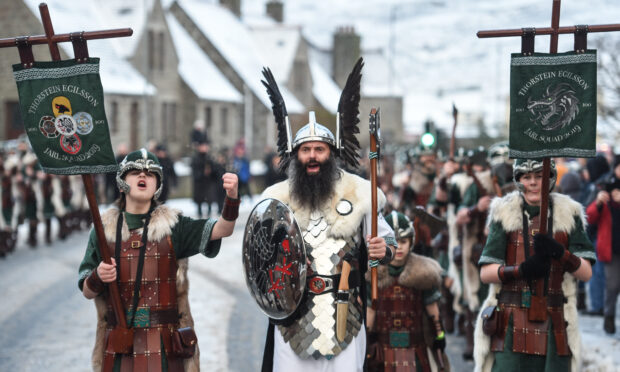 This year marks the first time girls will be allowed to join junior squads at Lerwick Up Helly Aa. Pictured is the event procession in 2019. Image: Jason Hedges/DC Thomson.