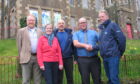 Members of the Oban Communities Trust gathered with representatives of contractors TSL outside The Rockfield Centre before work started. Image: Supplied.