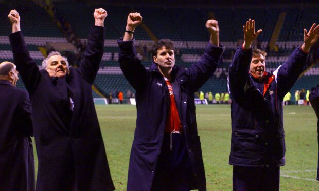 Steve Paterson, centre, salutes the Inverness fans after a famous victory over Celtic.
