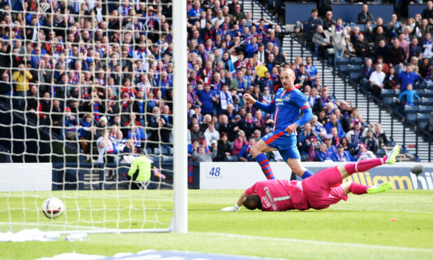 James Vincent slides home the goal which won Caley Thistle the Scottish Cup. Image: SNS